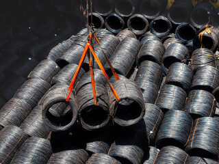 Top view of wire rods in coils stowage into cargo hold of the vessel, Discharging steel wire rod...
