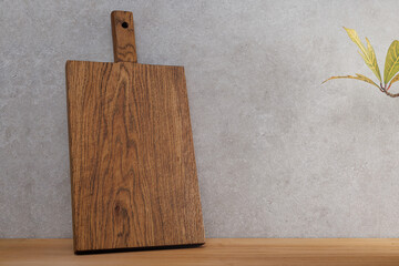 Old wooden cutting board on the table. Copy space for your text