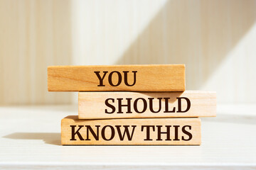 Wooden blocks with words 'You Should Know This'.