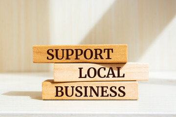 Wooden blocks with words 'Support Local Business'. Business concept