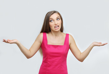 Fototapeta premium Portrait of confused young woman complaining