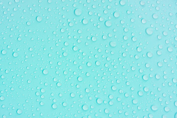 Fototapeta na wymiar Water drops on blue pastel color background