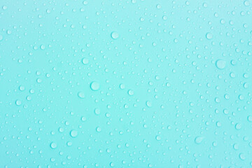 Water drops on blue pastel color background