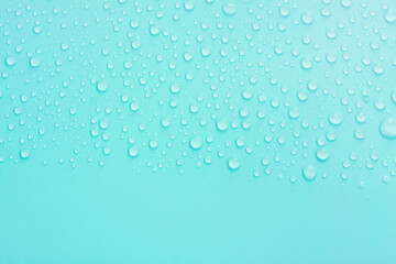 Water drops on blue pastel color background