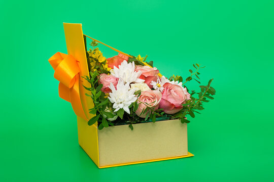 Original flower arrangement in a yellow gift box