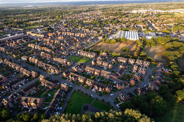 Top down aerial view of houses and streets in a residential area UK New Build Estate Agent House Prices 2022