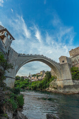 Fototapeta na wymiar MOSTAR, BOSNIA AND HERZEGOVINA - JAugust 13, 2022: View of Stari most (Old Bridge) in Mostar. Bosnia and Herzegovina