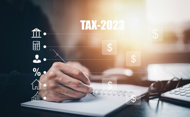Concept TAX-2023 and refund tax of duty taxation business, graphs, and chart being demonstrated on...