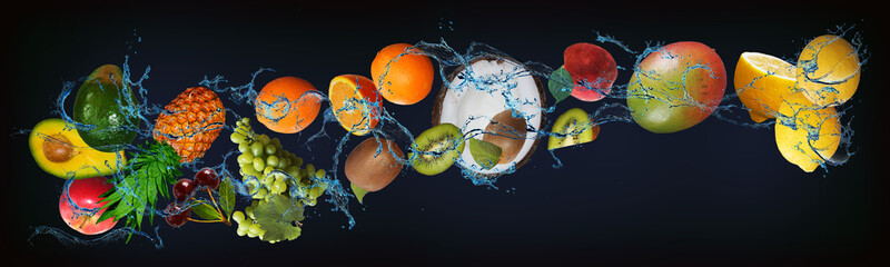Panorama with fruits in water - juicy lemon, mango, peach, kiwi, orange, grape, annas, avocado,...
