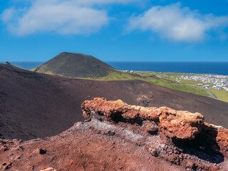 View of the Helgafell volcano from the top of the edge of the Eldfell volcano caldera, Heimaey,...
