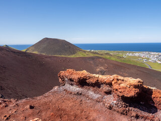 View of the Helgafell volcano from the top of the edge of the Eldfell volcano caldera, Heimaey,...