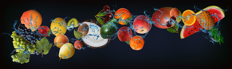 Panorama with fruits in water - juicy pineapple, orange, mango, lychee, apple, tangerine, peach,...