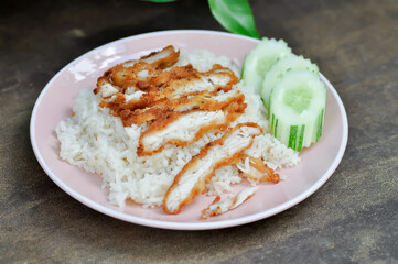 rice topped with chicken or chicken rice or fried chicken and rice