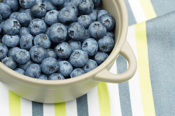 Blueberries from the garden. Summer berry harvest. Lots of fruit in the bowl. Top view.