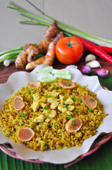 Fried Rice or Nasi Goreng With Sausage and Spices on Wooden Table