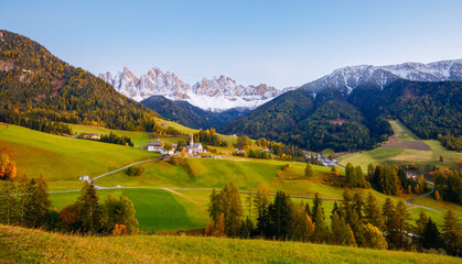 Autumn morning in St. Magdalena village with Odle range. Dolomite alps, Italy, Europe.