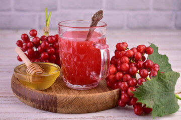 Healthy vitamin tea from viburnum with honey.
