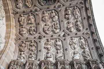 Detail of the religious stone sculptures on the portal of Dijon cathedral
