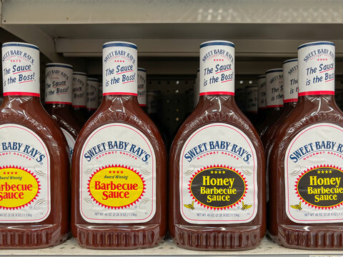 Houston, Texas, USA - February 22, 2022: Sweet Baby Ray's Original And Honey Barbecue Sauce 40 Oz. Bottles On The Shelf In A Supermarket. 