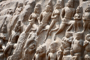 Human rock relief sculptures carved in the rock cut ancient cave temple in Mahabalipuram, Tamilnadu.