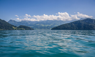 Swiss lake, mountains and blue sky