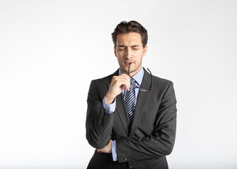 Close up portrait of thoughtful handsome business man in black suit isolated on white background