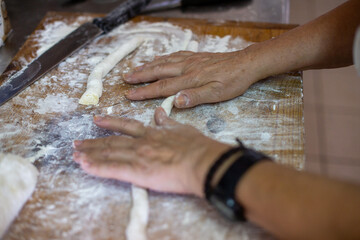 Obraz na płótnie Canvas baker kneading dough