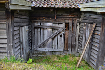 Shed of wooden planks with closed door