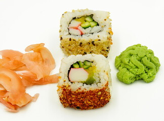 sushi on white plate on white background, ginger and wasabi