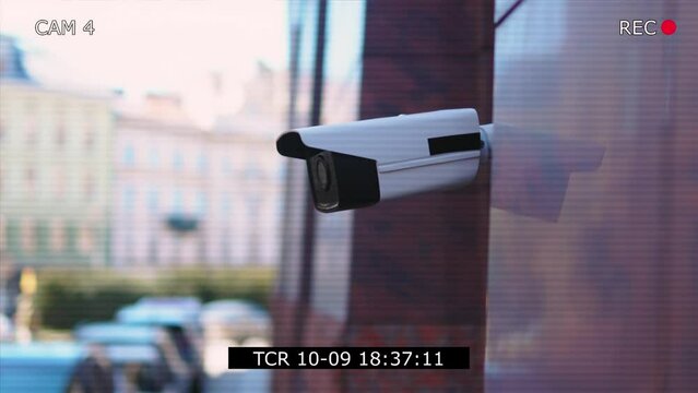 Record screen with security camera moving recording outside a building at sunlight. CCTV surveillance. Privacy, urban, protection, house, system, control, secure, view, safe, video. Slow motion