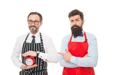 men competition in cooking. chef team in apron. Food delivery. fast food. bearded men with alarm clock. restaurant opening. lunch time. catering business. time to eat. We going to cook right now