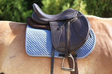 Close up of a sport horse saddle. Quality classical leather saddle