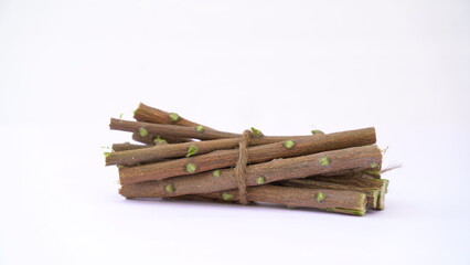 Herbal neem leaves and branch over white background. Medicinal neem twigs