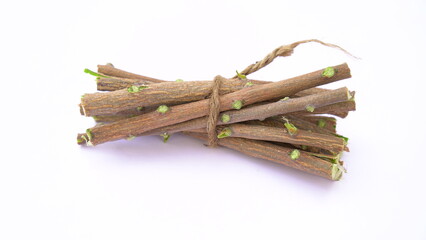Herbal neem leaves and branch over white background. Medicinal neem twigs