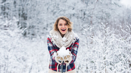 Fototapeta na wymiar Snow makes everything outdoors look amazing. Woman warm clothes snowy forest. Nature covered snow. Happiness. Exciting winter photoshoot ideas. Snow games. Building snowman. Frozen landscape