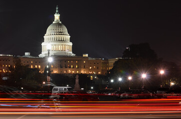 Car lights trails and US Capitol building at night - Washington DC, United States