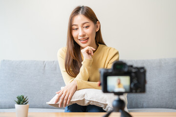 Vlogger influencer, attractive asian young woman blogger, content maker looking at camera,...