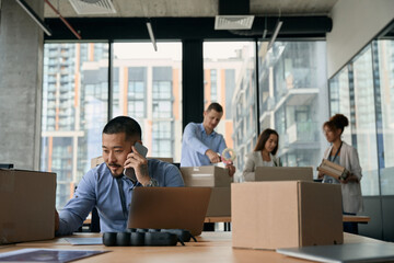 Group of company workers preparing for office relocation