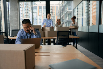 Team of corporate employees preparing for office move