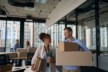 Happy corporate workers preparing for office relocation