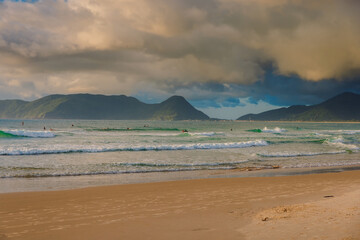 Fototapeta na wymiar Morro das Pedras beach and ocean with waves at sunrise