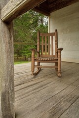 Vintage wooden rocking chair on rural front porch
