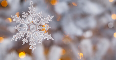 Winter snow background abstract bokeh. Snowflake Close-Up. Free space for text.