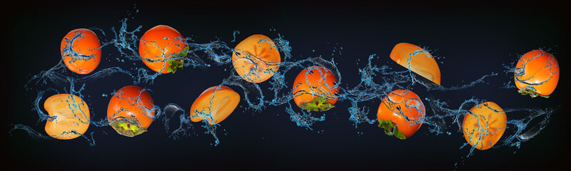 Panorama with fruits in water - juicy persimmons increase human immunity
