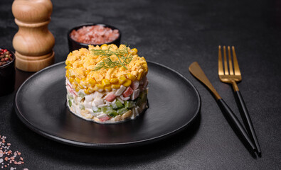 Fresh vegetable salad with corn, pepper, crab, cucumber, eggs and mayonnaise