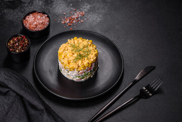 Fresh vegetable salad with corn, pepper, crab, cucumber, eggs and mayonnaise