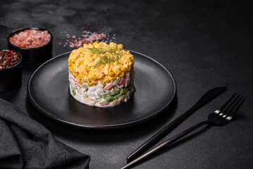 Fresh vegetable salad with corn, pepper, crab, cucumber, eggs and mayonnaise