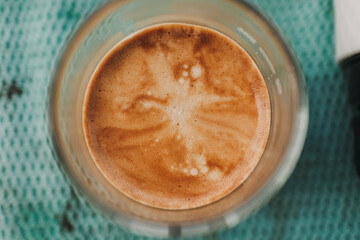 Above view of french press coffee with marble crema.