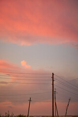 old wooden electric poles at sunset background