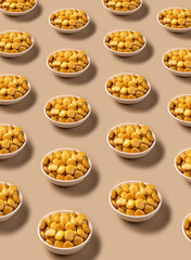 Food Pattern with salted lupins in white bowl standing on beige background
